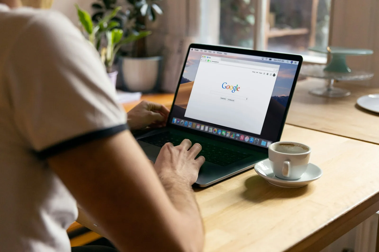 A person browsing financial resources on a laptop