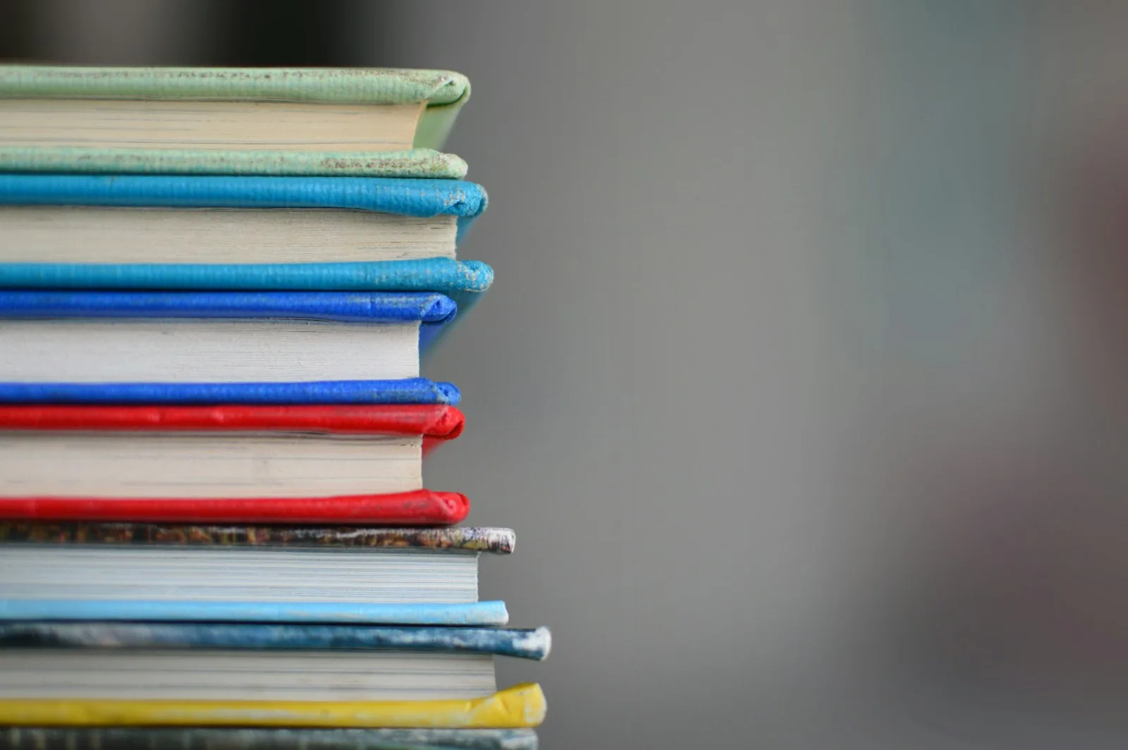 Finance books stacked one over another
