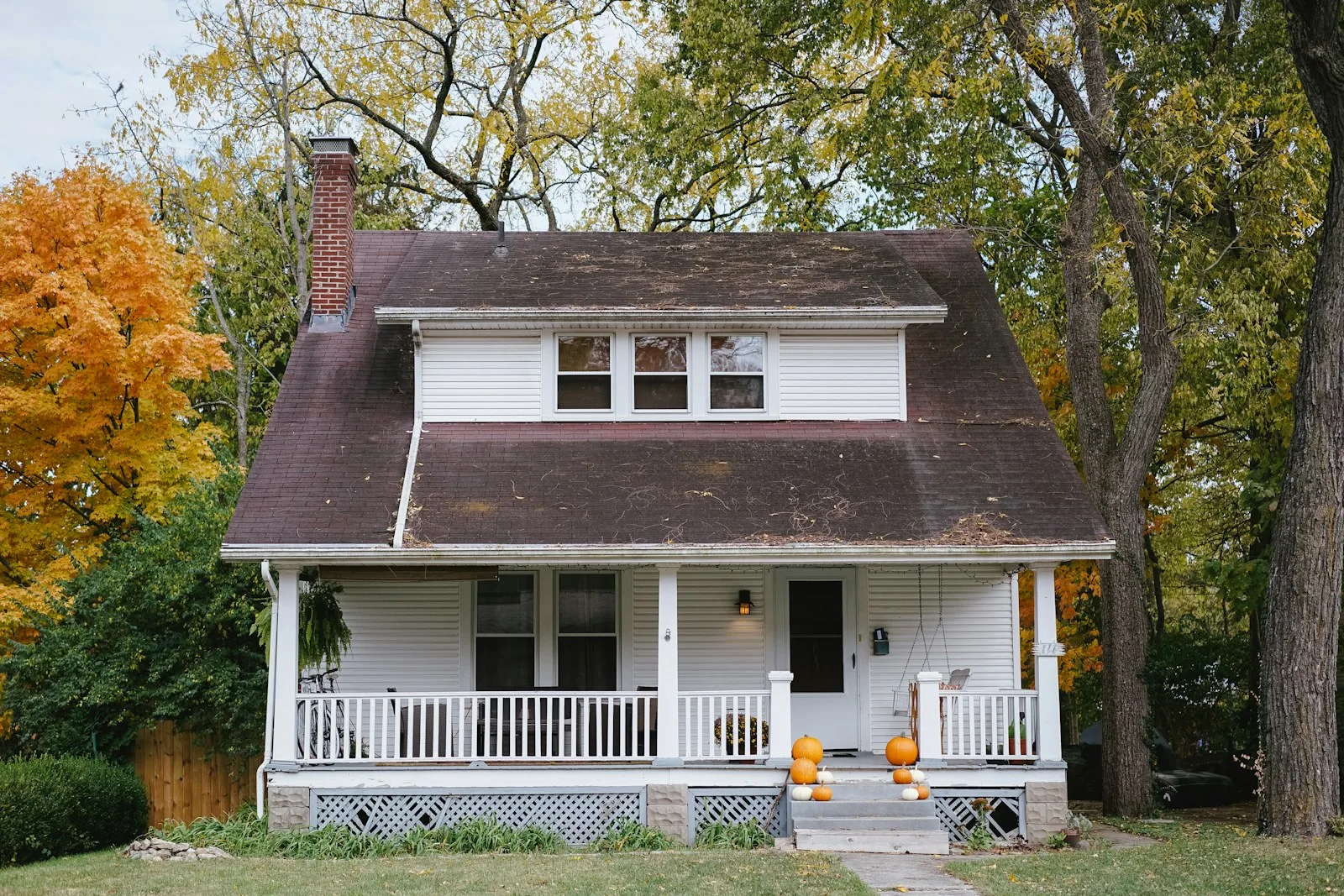 Image of a house with a beautiful background of trees