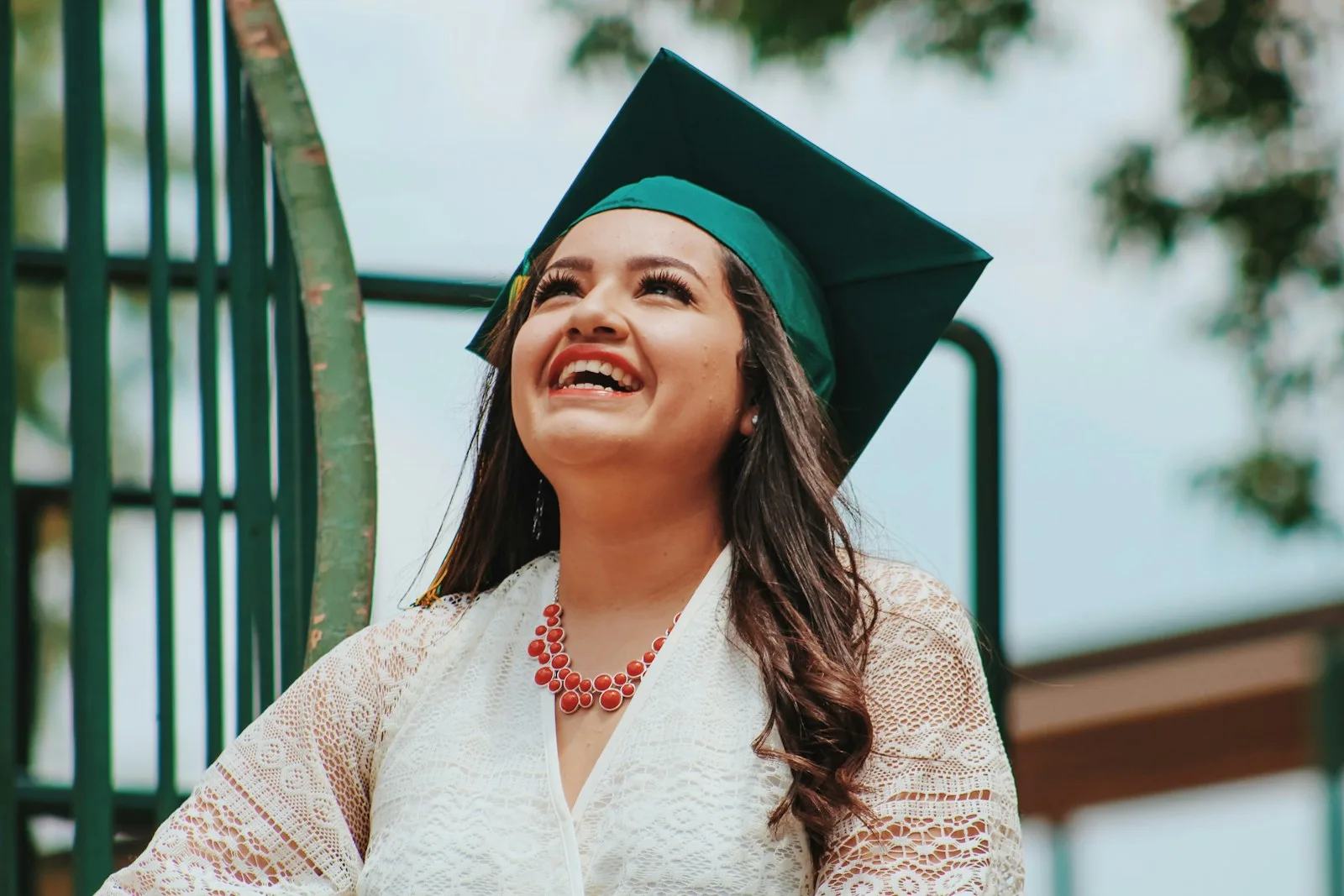 A student looking happy after graduating