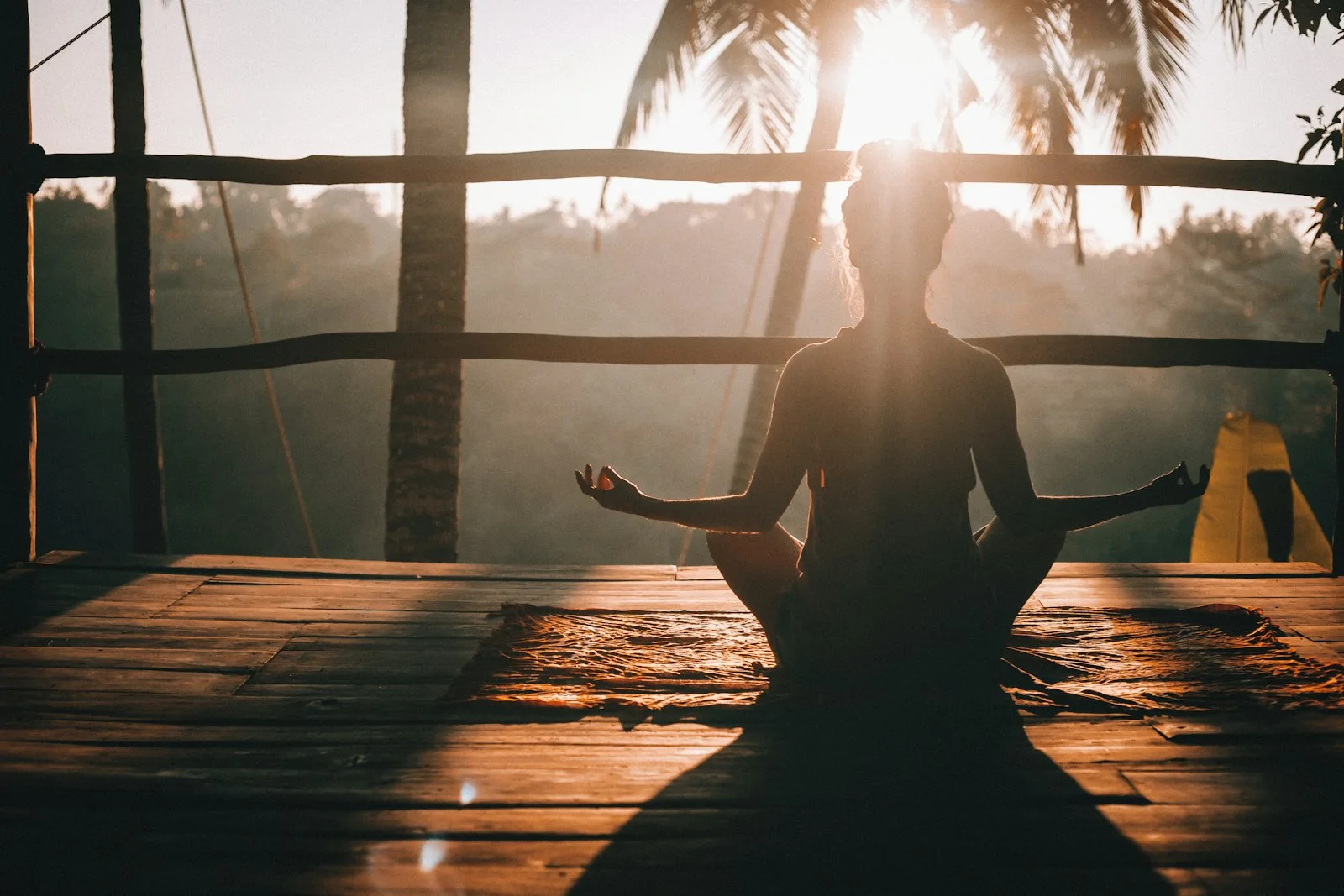 A person meditating as a form of self care after going through a divorce
