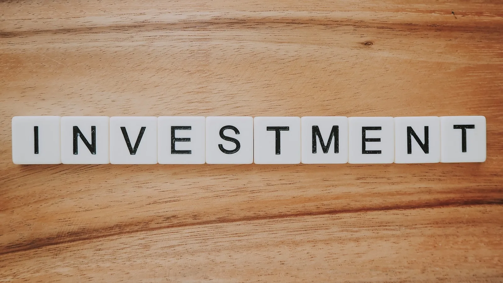 Blocks of letters forming the word “INVESTMENT”