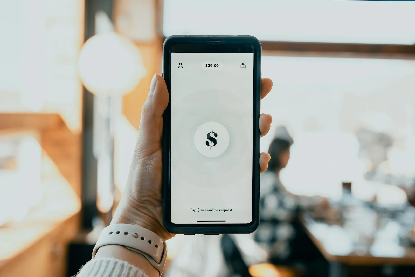 A person paying bill from their mobile phone