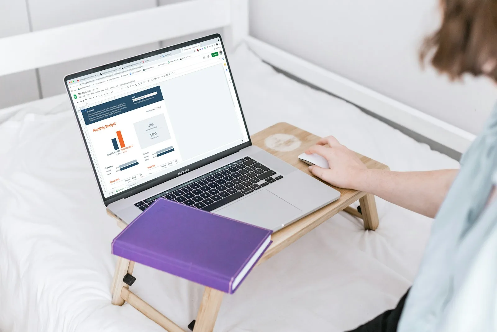 A person trying to create a budget for their personal finance on a laptop