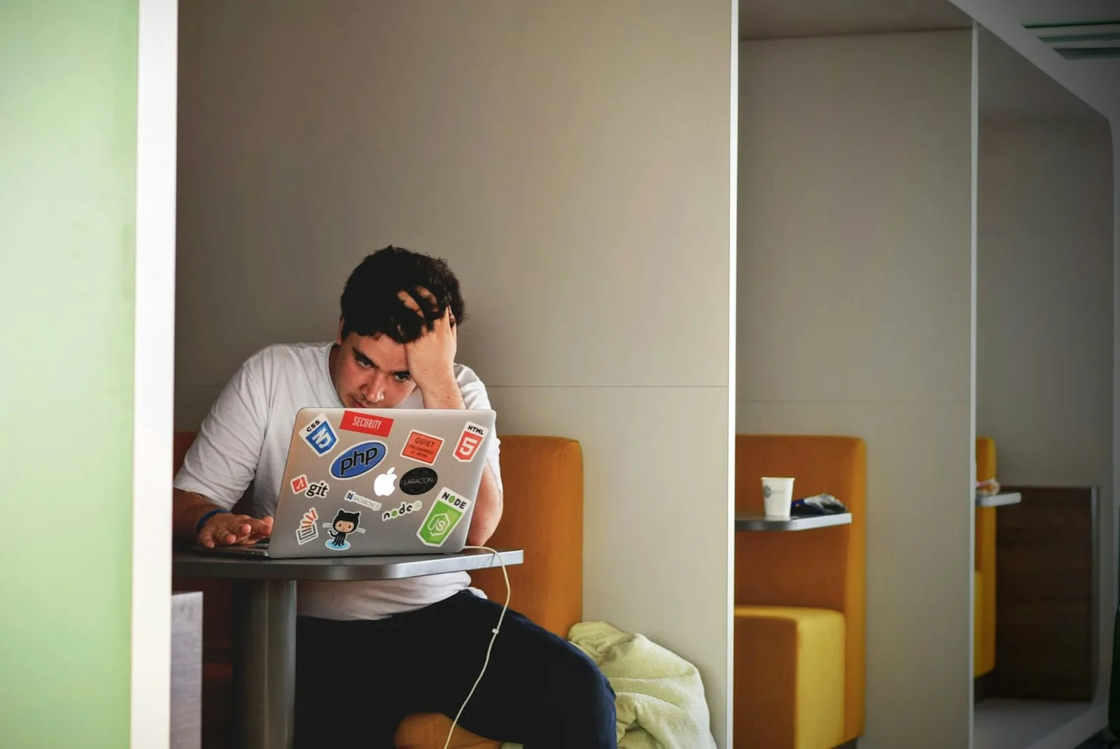 A young college student looking stressed after doing multiple side hustles